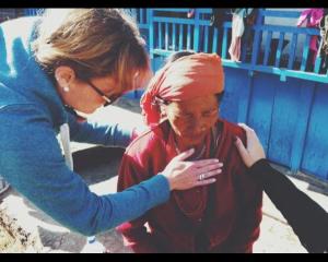 Praying for one of the few believers in the village.